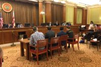 Steering Committee Member Meredith, far right, testifying
